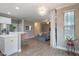 Inviting living space with open layout, stylish decor, and seamless flow between kitchen, dining, and living areas at 215 Outwater Ridge Dr, Garner, NC 27529
