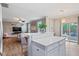 Open-concept living area featuring a large island with seating, seamlessly connecting the kitchen and living room at 215 Outwater Ridge Dr, Garner, NC 27529