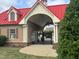 Pool house with red roof and gated entrance at 215 Outwater Ridge Dr, Garner, NC 27529
