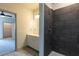 Bathroom featuring modern shower and vanity with a view into the bedroom at 2226 Gathering Sq Ct, Fuquay Varina, NC 27526