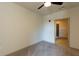 A comfortable bedroom features neutral carpet, ceiling fan and an adjacent ensuite bathroom at 2226 Gathering Sq Ct, Fuquay Varina, NC 27526