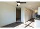 Open-concept living room with modern finishes, a ceiling fan, and ample natural light at 2226 Gathering Sq Ct, Fuquay Varina, NC 27526