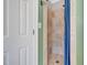 Shower room offers tiled walls, tiled floor, and glass shower door at 227 Paraggi Ct, Clayton, NC 27527