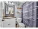 Bathroom with granite countertops, a decorative mirror, and a shower featuring a unique aircraft curtain at 227 Paraggi Ct, Clayton, NC 27527