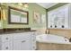 Bathroom features a soaking tub, decorative tile, and granite countertops at 227 Paraggi Ct, Clayton, NC 27527