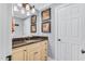 Bathroom featuring a vanity, granite countertop, decorative mirror, and framed art on the light blue walls at 227 Paraggi Ct, Clayton, NC 27527