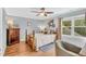 Charming bedroom featuring hardwood floors, natural light, wooden furniture, and decorative wall art at 227 Paraggi Ct, Clayton, NC 27527