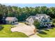Stunning two-story home with a detached garage, expansive driveway and beautiful landscaping at 227 Paraggi Ct, Clayton, NC 27527