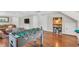 Game room with hardwood floors featuring a foosball table, entertainment center, and shelf at 227 Paraggi Ct, Clayton, NC 27527