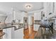 Modern kitchen with white cabinets, stainless steel appliances, and granite countertops at 227 Paraggi Ct, Clayton, NC 27527