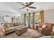 Spacious living room filled with natural light, comfortable seating and a view of the pool at 227 Paraggi Ct, Clayton, NC 27527