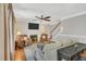 Comfortable living room features a fireplace, ceiling fan, and staircase to the upper level at 227 Paraggi Ct, Clayton, NC 27527