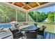 Covered patio with ceiling fan, a table with chairs, and a view of the swimming pool at 227 Paraggi Ct, Clayton, NC 27527
