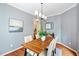 Elegant dining room featuring hardwood floors and gray walls at 2305 Bryarton Woods Dr, Raleigh, NC 27606