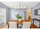 Elegant dining room featuring hardwood floors and gray walls at 2305 Bryarton Woods Dr, Raleigh, NC 27606