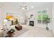 Spacious living room with high ceilings, a cozy fireplace, and large windows at 2305 Bryarton Woods Dr, Raleigh, NC 27606