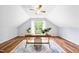 Cozy office space with hardwood floors, a decorative rug, large window and a wooden desk at 2305 Bryarton Woods Dr, Raleigh, NC 27606