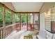 Screened-in porch with wood flooring offers views of the backyard and a relaxing outdoor space at 2305 Bryarton Woods Dr, Raleigh, NC 27606