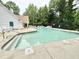 A community swimming pool with lounge chairs ready for relaxing in a park-like setting at 2305 Bryarton Woods Dr, Raleigh, NC 27606