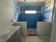 Bathroom with space for a vanity, toilet, and an enclosed shower area with a window at 256 Meadowbark Bnd # 45, Garner, NC 27529