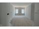 Unfinished bedroom showcasing natural light from the windows and ample space for furnishings at 256 Meadowbark Bnd # 45, Garner, NC 27529