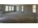 Bright living room with large windows offering ample natural light and a spacious open layout at 256 Meadowbark Bnd # 45, Garner, NC 27529