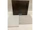 Material board showcasing countertop, dark cabinet door, and stone flooring tile at 256 Meadowbark Bnd # 45, Garner, NC 27529