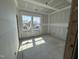 Bedroom with drywall, tray ceiling, and two windows providing natural light at 264 Meadowbark Bnd # 43, Garner, NC 27529