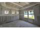 Bedroom with tray ceiling and several windows offering ample natural light at 264 Meadowbark Bnd # 43, Garner, NC 27529