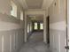 Bright hallway with tray ceiling, recessed lighting, and large windows at 264 Meadowbark Bnd # 43, Garner, NC 27529