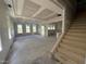 Spacious living room featuring a staircase, multiple windows, and ample natural light at 264 Meadowbark Bnd # 43, Garner, NC 27529