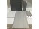 Sample board of tile selections, including mosaic accent tile, planks, and wall tiles with a cabinet in grey at 264 Meadowbark Bnd # 43, Garner, NC 27529