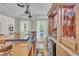 Interior bar with hardwood floors, custom shelving, wine fridge and decorative lighting at 2721 Jazzy St, New Hill, NC 27562