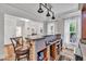 Interior bar with hardwood floors, custom shelving and decorative lighting at 2721 Jazzy St, New Hill, NC 27562