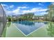 Community basketball court with trees in the background, and a fence around it at 2721 Jazzy St, New Hill, NC 27562