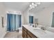 Bathroom featuring double sinks, granite countertops, and neutral tile at 2721 Jazzy St, New Hill, NC 27562
