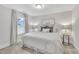 Calm bedroom with neutral tones, soft carpet, and natural light from the window at 2721 Jazzy St, New Hill, NC 27562