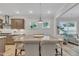 Dining room with a view of the kitchen and plenty of seating and natural light at 2721 Jazzy St, New Hill, NC 27562