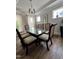Dining room featuring a glass-top table with seating for eight at 2721 Jazzy St, New Hill, NC 27562