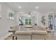 Dining room with large table, upholstered chairs, and ample natural light at 2721 Jazzy St, New Hill, NC 27562