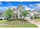 Beautiful two-story home with a manicured lawn, stone accents and an attached garage at 2721 Jazzy St, New Hill, NC 27562