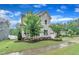 Charming two-story home with a manicured lawn, beautiful foliage and an attached garage at 2721 Jazzy St, New Hill, NC 27562