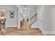Spacious foyer with hardwood floors and a staircase leading to the upper level at 2721 Jazzy St, New Hill, NC 27562