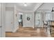 Bright foyer with hardwood floors and an office with natural light at 2721 Jazzy St, New Hill, NC 27562