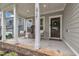 Charming front porch with seating area and decorative fountain feature at 2721 Jazzy St, New Hill, NC 27562