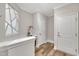Hallway featuring stylish flooring, modern lighting, and a convenient built-in desk area at 2721 Jazzy St, New Hill, NC 27562