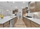 Spacious kitchen with stainless steel appliances, custom cabinets, and a large island at 2721 Jazzy St, New Hill, NC 27562