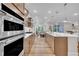 Bright kitchen with stainless appliances, sleek cabinetry, ample counter space, and modern fixtures at 2721 Jazzy St, New Hill, NC 27562