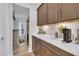 Kitchen nook featuring a beverage station, coffee bar, ample storage, and modern backsplash at 2721 Jazzy St, New Hill, NC 27562