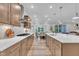Gourmet kitchen with stainless appliances, sleek cabinetry, ample counter space, and modern fixtures at 2721 Jazzy St, New Hill, NC 27562